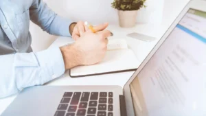 Podiatry biller reviewing a CPT, modifier and ICD-10 cheat sheet for foot care claims