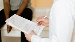 Clinician reviewing wound care documentation for a CPT 97597 selective debridement claim