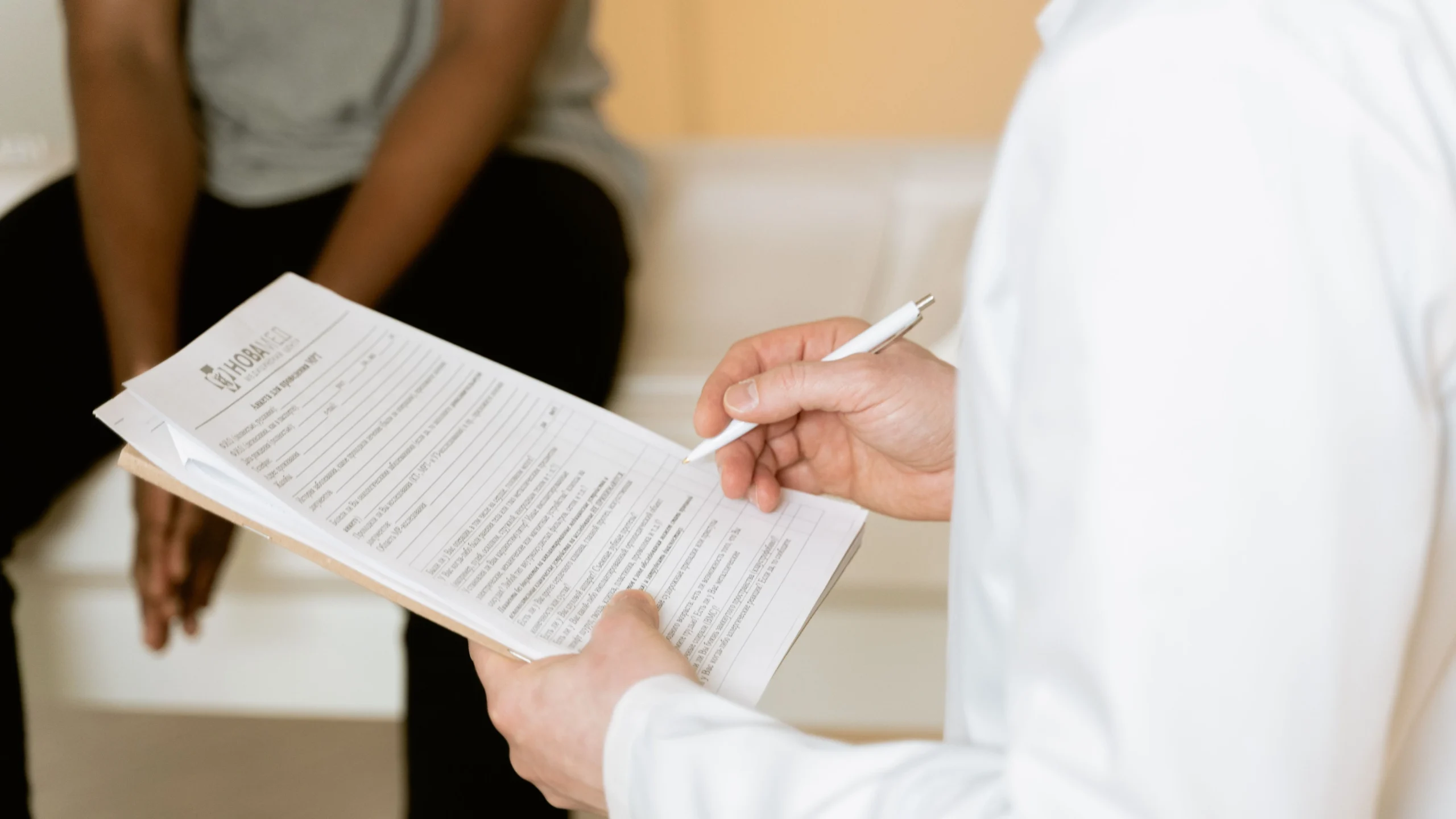 Clinician reviewing wound care documentation for a CPT 97597 selective debridement claim