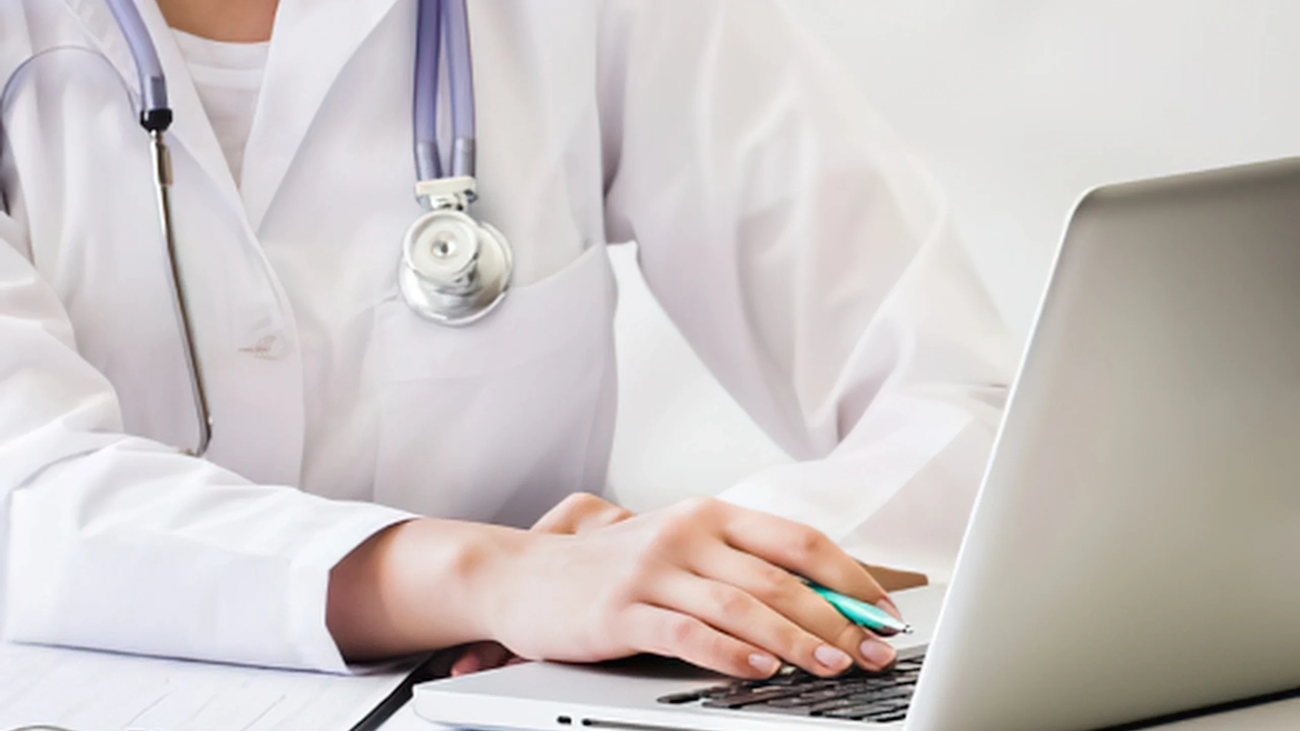 Podiatrist at a laptop reviewing MIPS 2026 value pathway quality reporting requirements