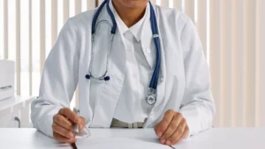 Podiatrist at a desk reviewing 2027 Medicare fee schedule payment changes