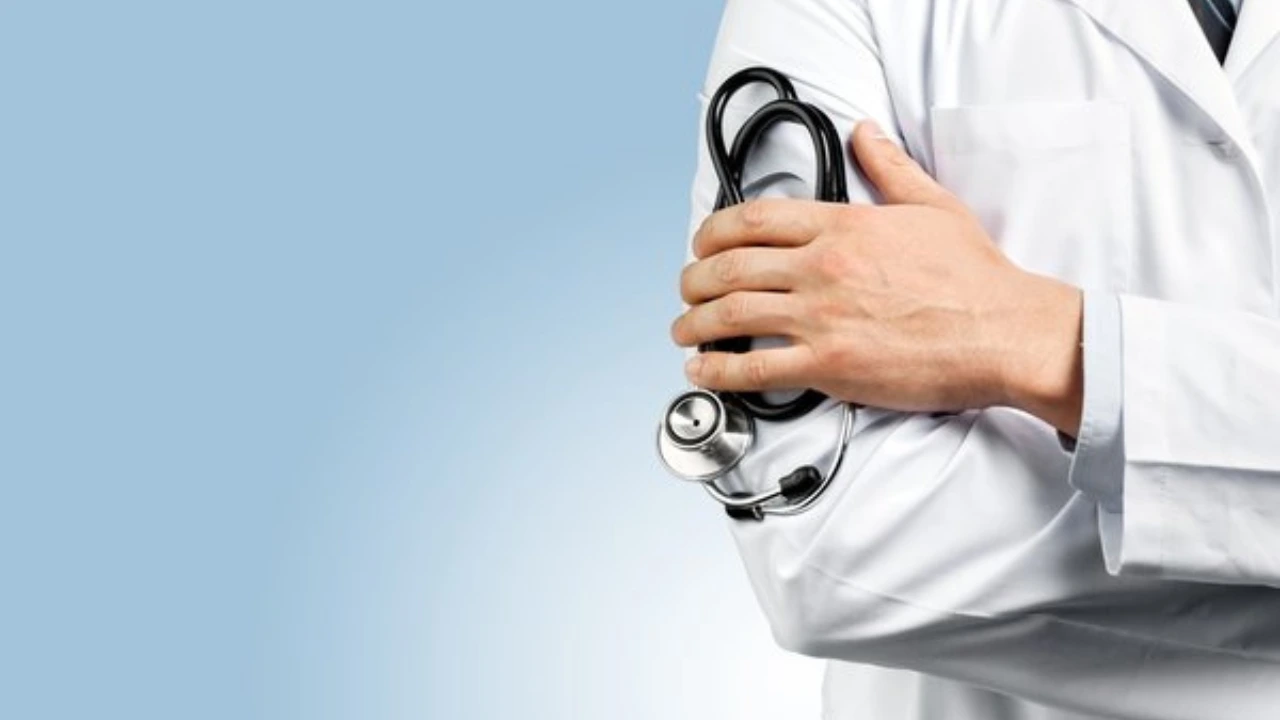Clinician examining a patient heel for plantar fasciitis coded as ICD-10 M72.2